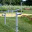 Outdoor playground equipment Acrobat on green grass.