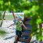 Children playing on Searobber Castle castle with slide in a playground.