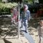 Children playing on the Balances playground equipment.