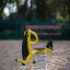 Yacht Swing rocking playground equipment in a sandy area
