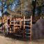 King-Kong Nature castle with slide in a playground surrounded by trees