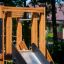 Wooden playground equipment of King-Kong Nature castle with slide.