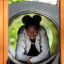 Child playing inside the Tritowers Nature castle with slide.