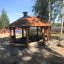 Long Firehouse outdoor wooden pavilion with seating in a park setting