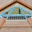 Long Firehouse wooden playhouse window detail with metal mesh safety grille
