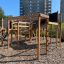 Playground structure Space Station Nature castle with slide with climbing elements and slides in an 