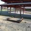 Sandbox Nature under a covered outdoor area.