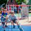 Children playing on Mini Climber steel structure on playground