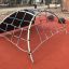 Mini Climber steel structure on a playground with climbing nets.