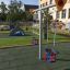 Baby Double Swing in a playground with safety surfaces and green area in the background