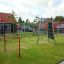 Double Somersault climbing structure and swings in a playground