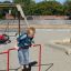 A boy playing on the Double Somersault playground equipment.