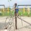 Children playing on Kilimanjaro steel structure in playground.