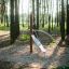 Outdoor playground equipment 'Kilimanjaro steel structure' in a forest setting.