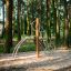 Kilimanjaro steel structure playground climbing frame in a forest setting.