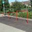 Red metal playground structure Triple Somersault for children's outdoor exercise