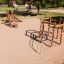 Sherwood wooden playhouse on a sandy playground.