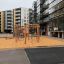 Wooden playhouse in modern urban playground.