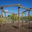 Yellowstone wooden playhouse outdoor climbing frame with rope net