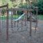 Yellowstone wooden playhouse climbing net on playground