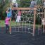 Children playing on Yellowstone wooden playhouse.