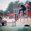Children playing on the Seesaw in a colorful playground.