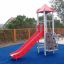 Ladybird playhouse with slide on a playground.
