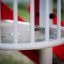 Red and white Ladybird playhouse with slide.