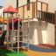 Beetle playhouse with slide, colorful playground structure.