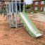 Beetle playhouse with slide, steel structure in playground.