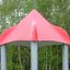 Beetle playhouse with slide, steel structure in a park.