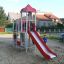 Beetle playhouse with slide, steel structure in a playground.