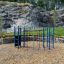 Outdoor Orca steel structure playground equipment in a scenic park setting.