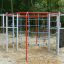Orca steel structure playground equipment in park with climbing nets and ropes.