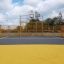 Outdoor sports court with fences and basketball hoop, product Maracana.