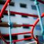 Red and blue Whale steel structure playground equipment in an urban area