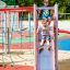 Children playing on Whale steel structure playground slide.