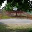 Olimpico playground with basketball hoop and fenced area