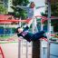 Children playing on Butterfly steel structure at a playground.
