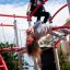 Children playing on the Butterfly steel structure in a playground.