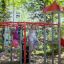 Children playing on the Butterfly steel structure in a playground.