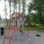 Butterfly steel structure on playground with children climbing and playing outdoors