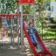 Children playing on a Butterfly steel structure with slide.