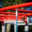 Close-up of the Butterfly steel structure with red steel bars and hanging blue ropes.