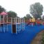 Children's playground with colorful Spider steel structure and various climbing frames.
