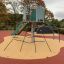 Crow's Nest steel structure on a playground with climbing ropes and a slide.