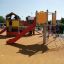 Crow's Nest steel structure playground equipment with a slide and climbing net for children.