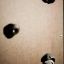 Climbing holds on Stranda wooden playhouse wall.