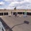 Outdoor sports court with children playing roller hockey, featuring Anfield Road multifunctional spo