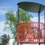 Referee Seat with red guardrails in an outdoor playground setting